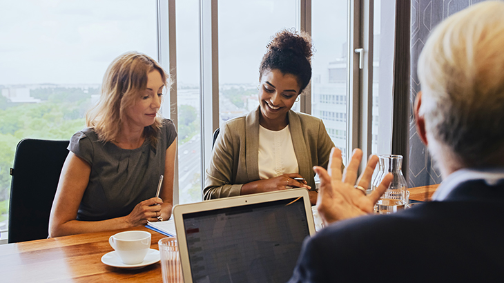 A diverse group of businesspeople in a conference room.
